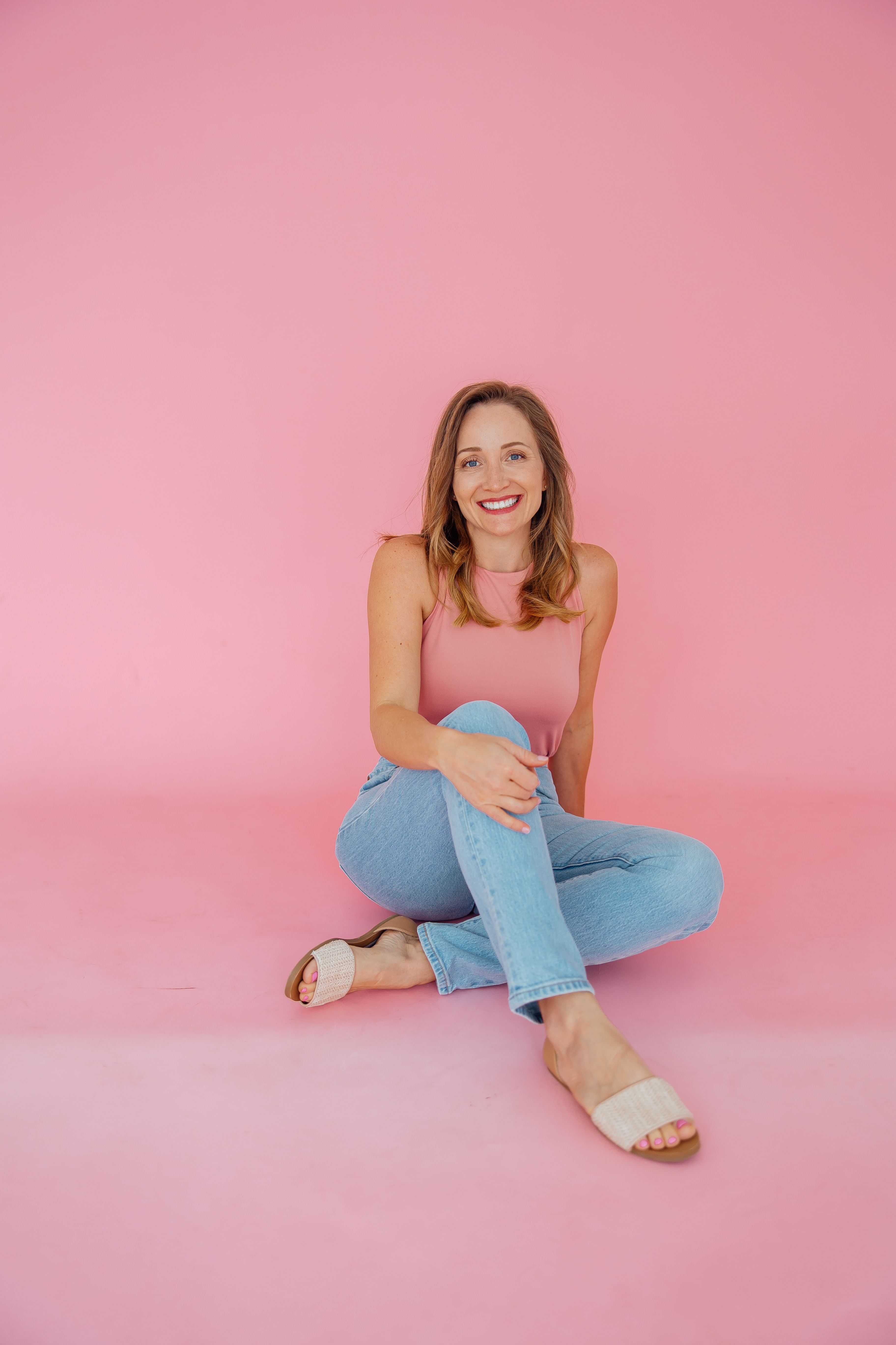 Ali Chappell smiling in pink